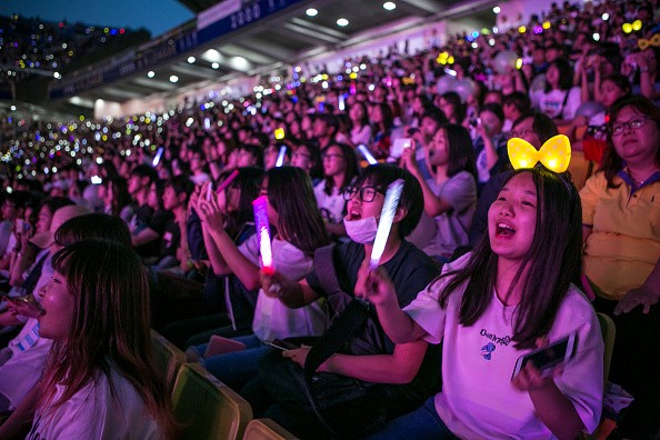 EXO-Ls cheer as EXO performs during the commemoration of the 220th anniversary of Suwon-Hwaseong Fortress.