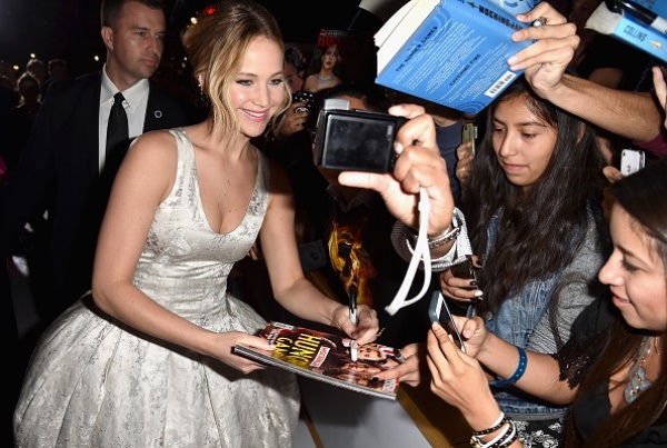Actress Jennifer Lawrence posed for a selfie with fans at the premiere of Lionsgate's "The Hunger Games: Mockingjay - Part 1" at Nokia Theatre L.A. Live on November 17, 2014 in Los Angeles, California.