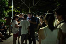 Gamers play Pokemon Go on their smartphones on August 7, 2016 in Taipei, Taiwan.