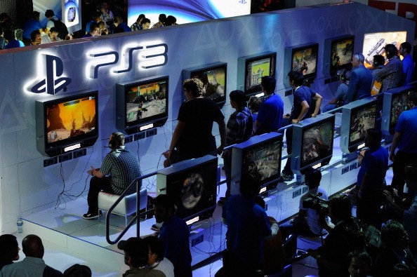 Gamers and show attendees play video games at the Sony Playstation booth during the Electronic Entertainment Expo on June 7, 2011 in Los Angeles, California. 